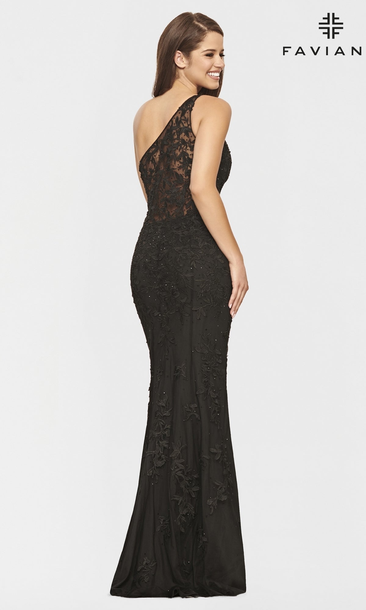 Woman wearing a One-Shoulder Faviana Long Lace Formal Dress in black, featuring lace details and an asymmetrical neckline, stands smiling and is seen from the back.